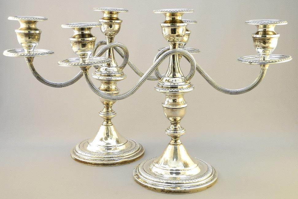 Pair of Sterling silver candelabras, 10".: Pair of Sterling silver candelabras, 10".
