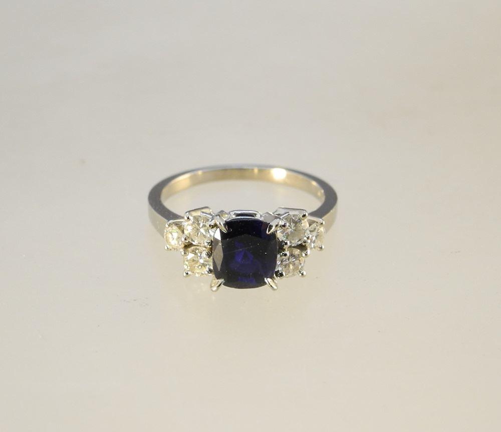 18K White Sapphire Ring Flanked with six Diamonds. (1 of 4)