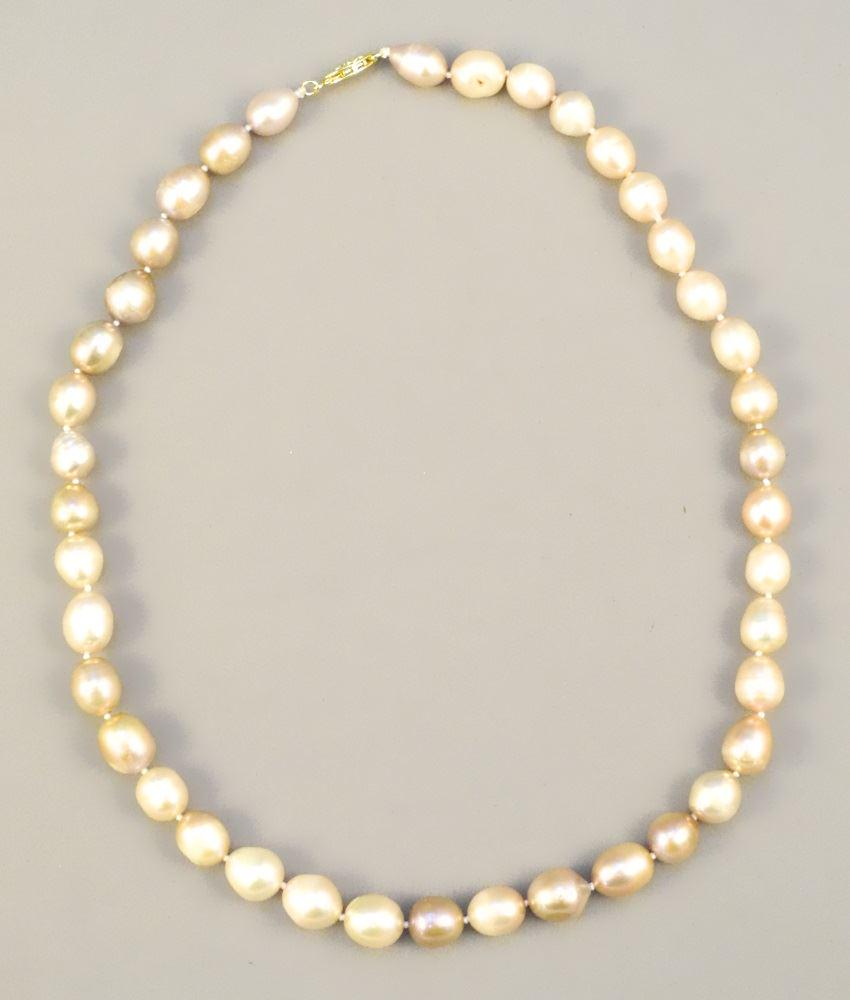 Strand of Pink Baroque Pearls with 14K gold clasp.: Strand of Pink Baroque Pearls with 14K gold clasp.