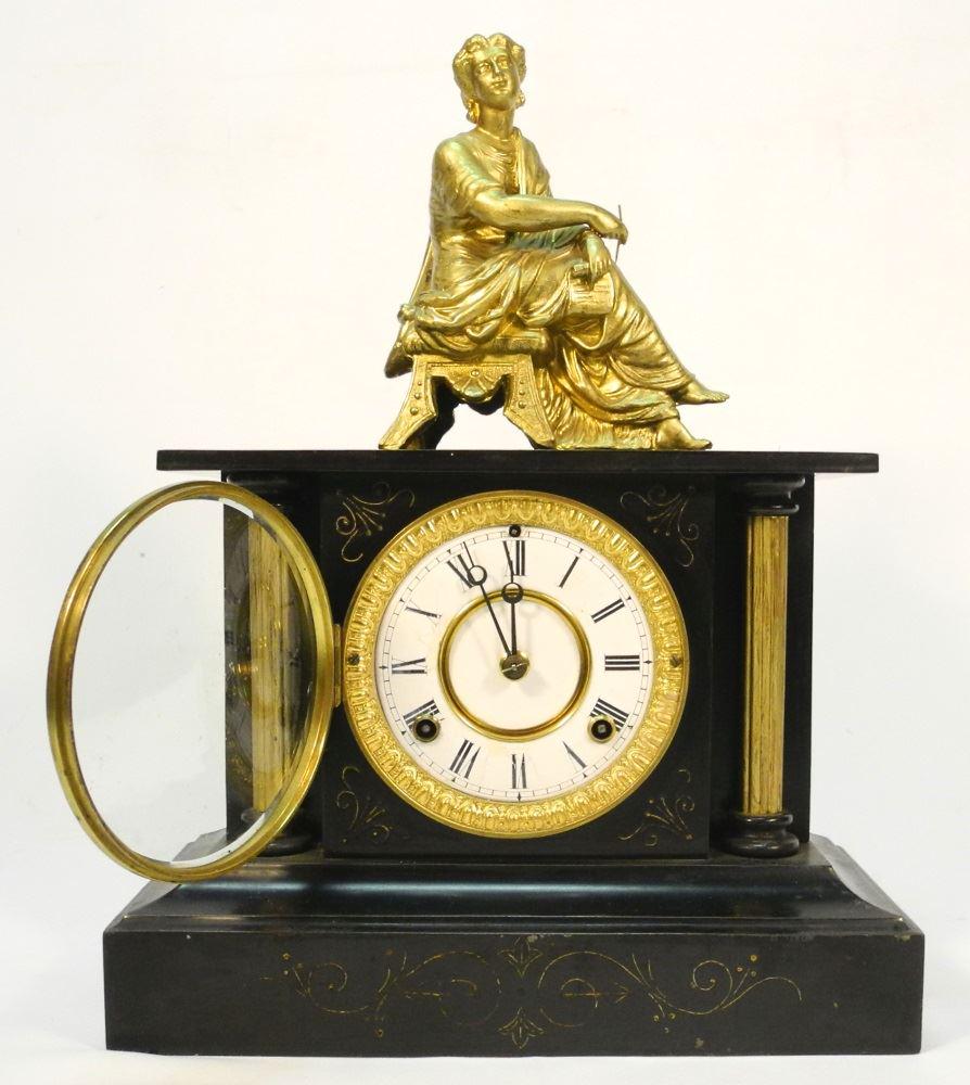 Cast iron neoclassical mantle clock with gilt figural (1 of 2)