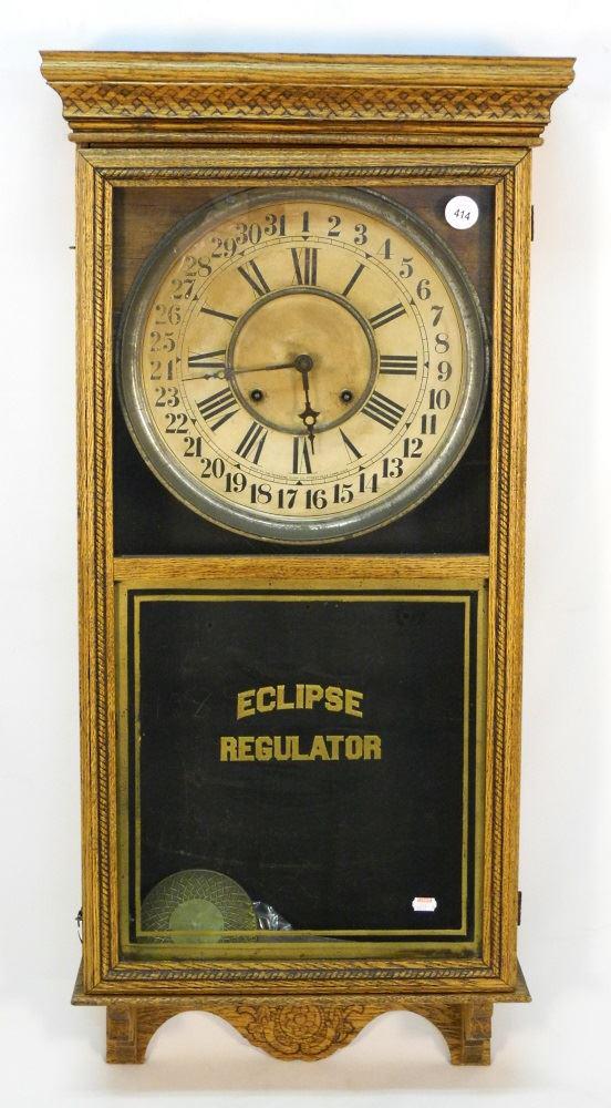 Eclipse oak cased regulator wall clock. (1 of 5)
