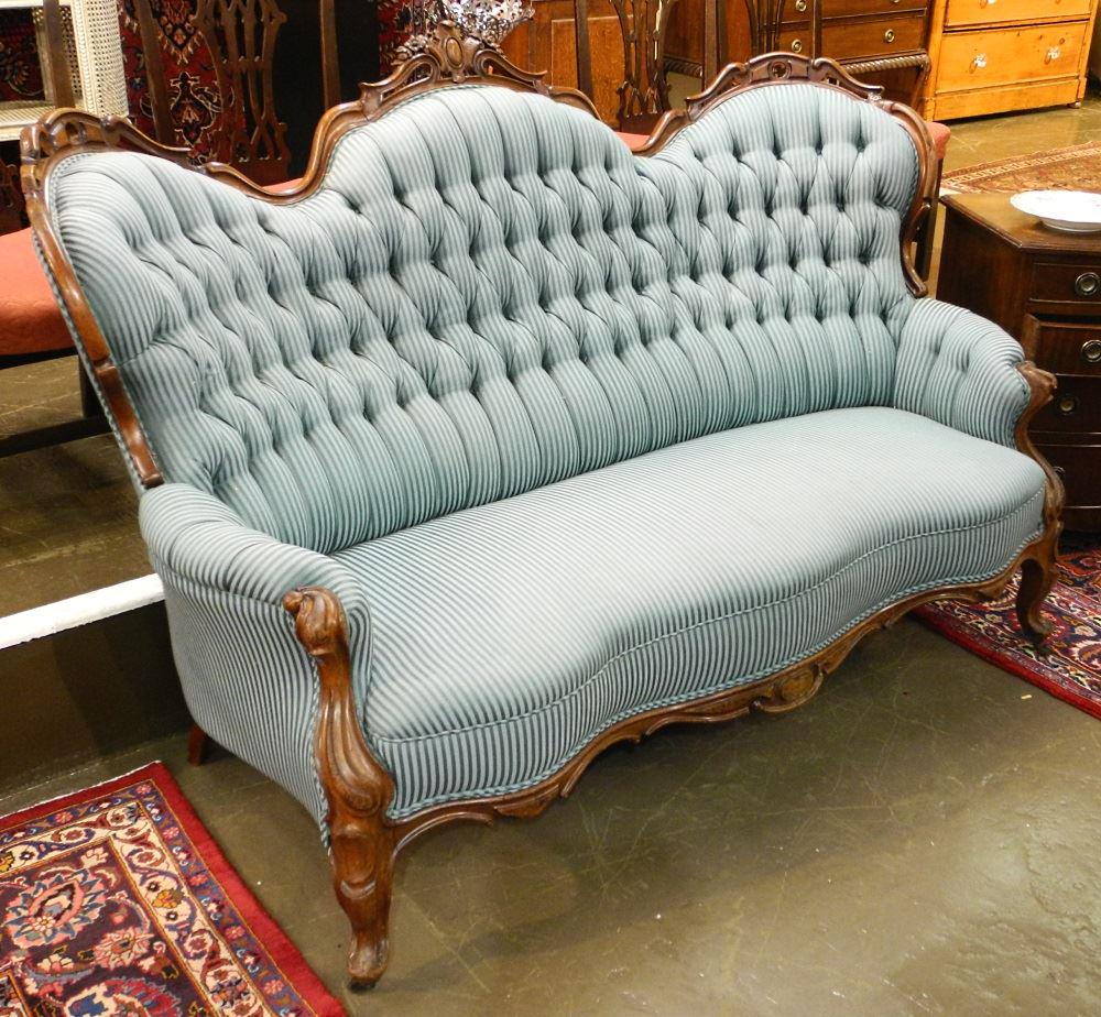 Victorian carved mahogany & button tufted settee. (1 of 2)