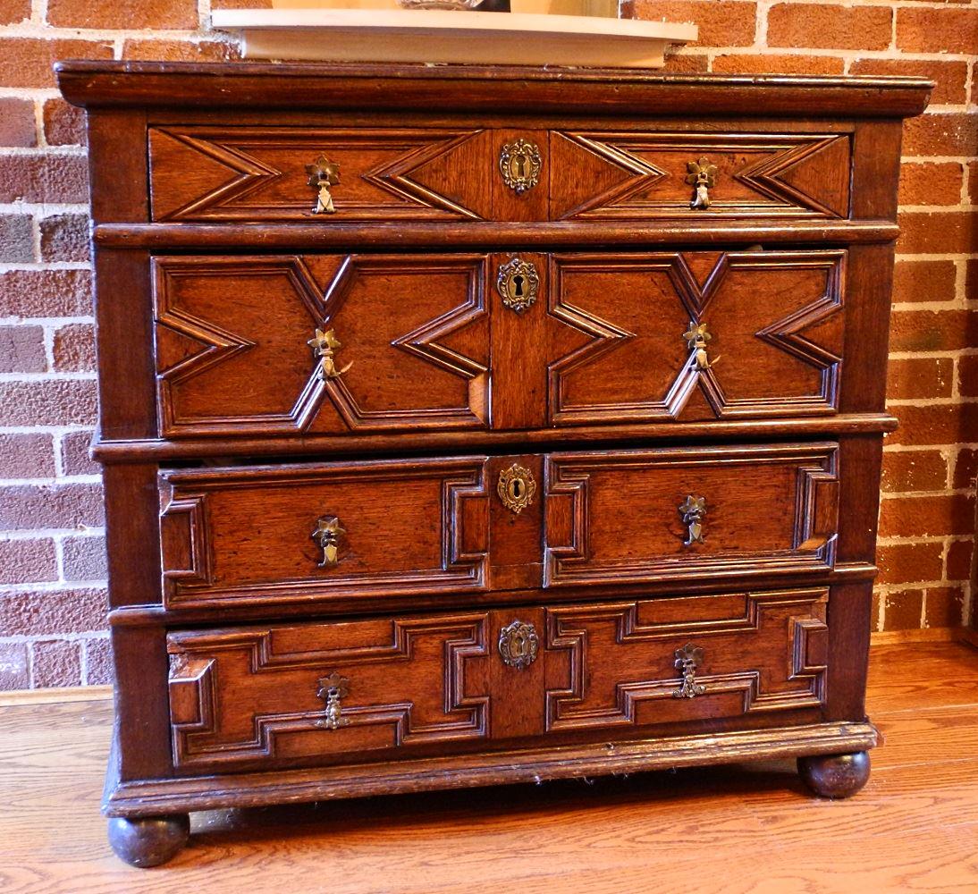 Late 17th / early 18th century carved oak four drawer (1 of 9)