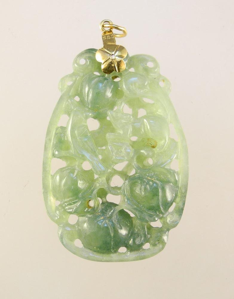 14K gold pendant set with a jadeite decorated with bird: 14K gold pendant set with a jadeite decorated with bird and rat.