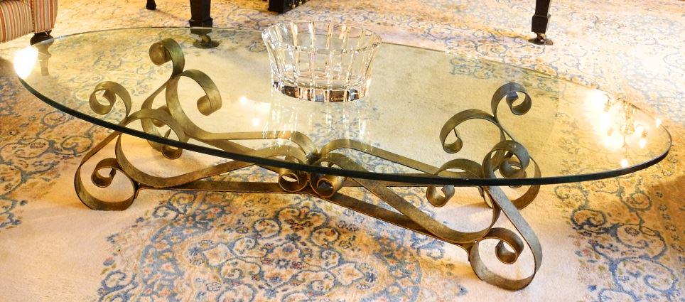Oval glass topped metal base coffee table. (1 of 3)