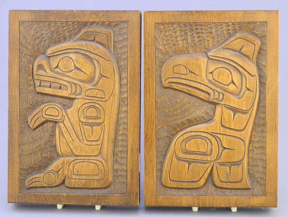 Pair of Kwagiulth carved cedar plaques, 8" x 5 1/2" x (1 of 2)