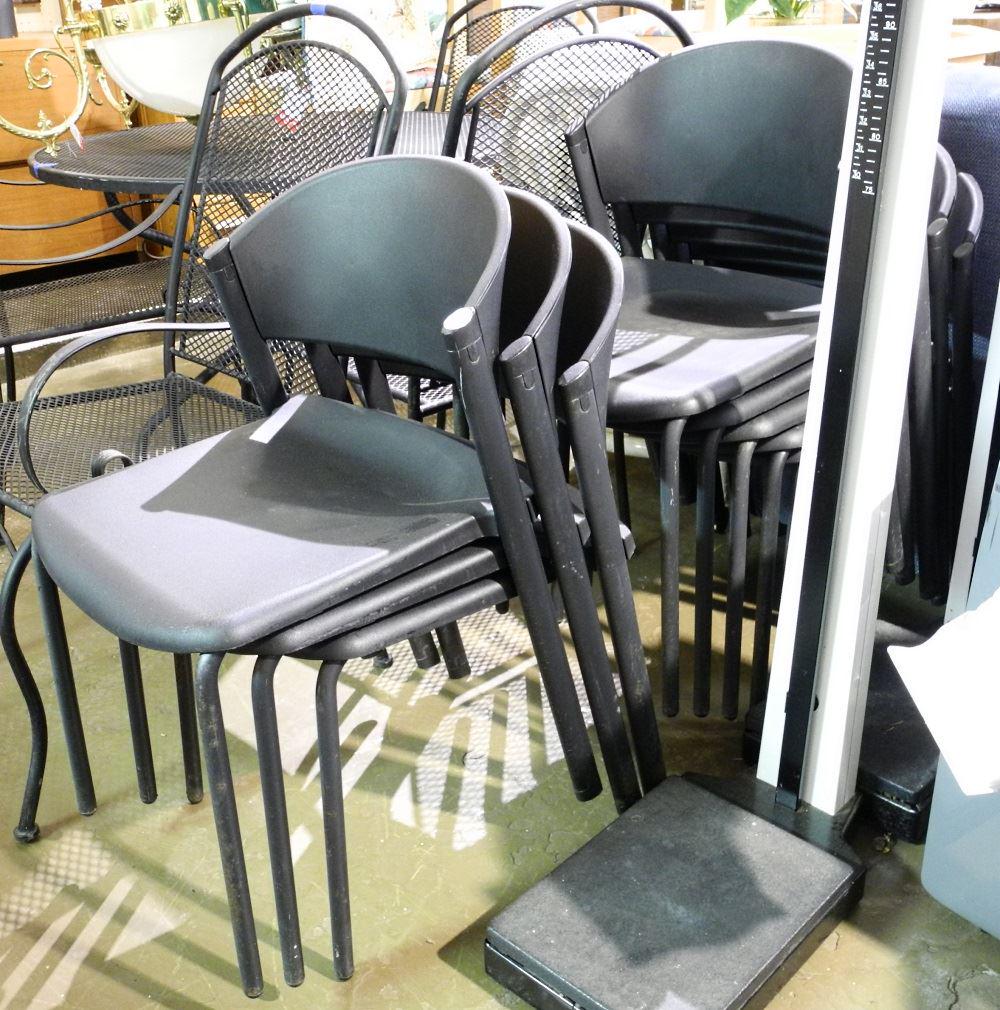 Eight black patio chairs.: Eight black patio chairs.