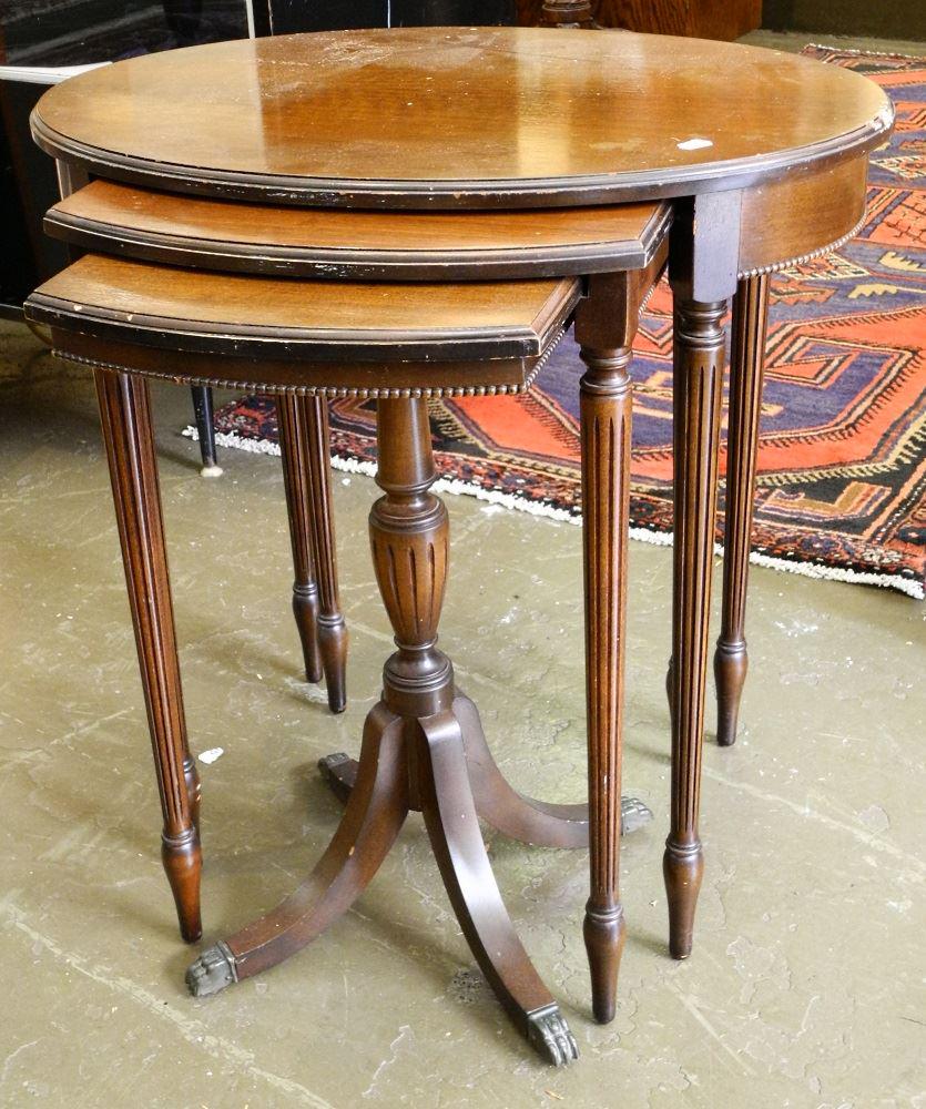 Trio of Oval Walnut Nesting Tables, 24" high, as found.: Trio of Oval Walnut Nesting Tables, 24" high, as found.