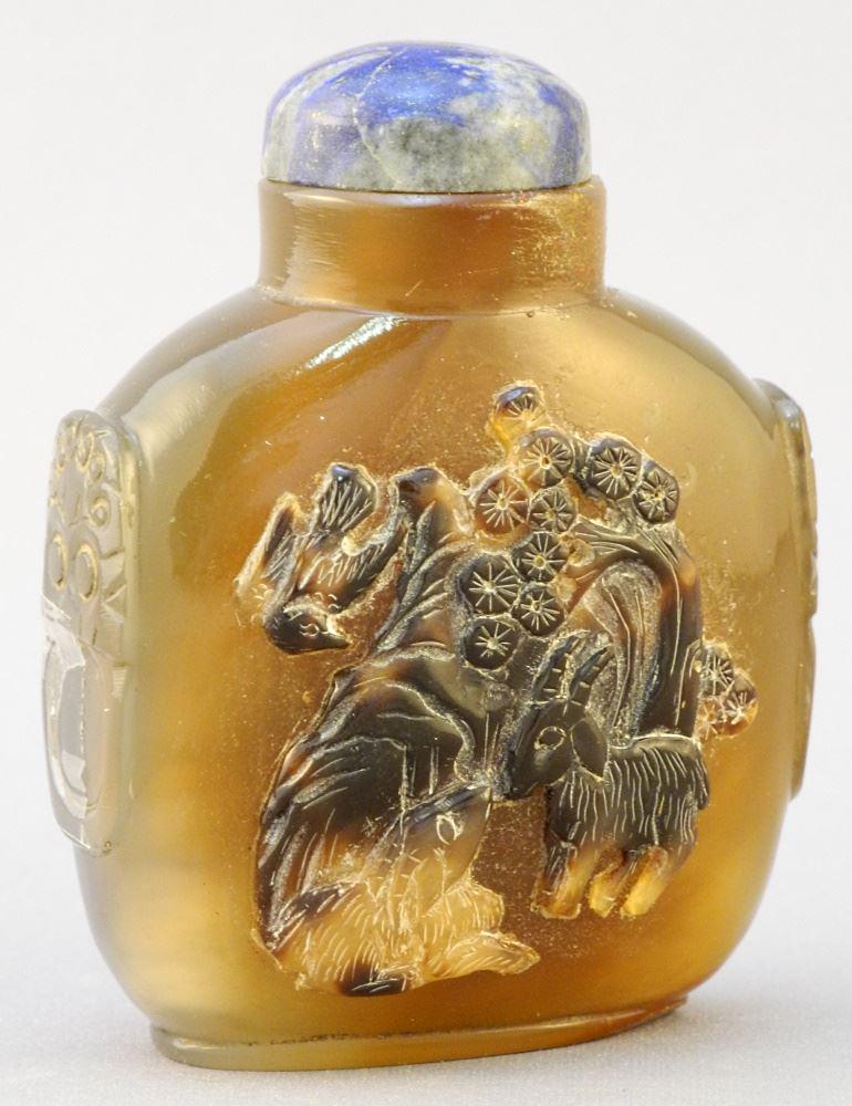 Quartz snuff bottle with lapis top and relief (1 of 4)