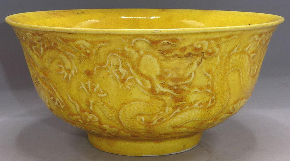 Yellow Ground "Flaming Dragons" Ritual Bowl, bearing: Yellow Ground "Flaming Dragons" Ritual Bowl, bearing Hongzhi mark, 6 1/8" across.