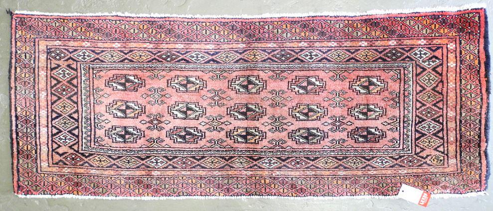 Bokhara Mat, Pale Raspberry approximately 47" x 18". (1 of 3)