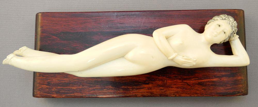 Chinese Carved reclining figure on Stand, 7" length, no: Chinese Carved reclining figure on Stand, 7" length, no export.