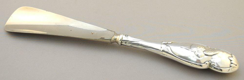 Hallmarked William Comyns & Sons London 1902-3 Cherub Shoe Horn, "Comyns Angels", 10 1/2".: Hallmarked William Comyns & Sons London 1902-3 Cherub Shoe Horn, "Comyns Angels", 10 1/2".