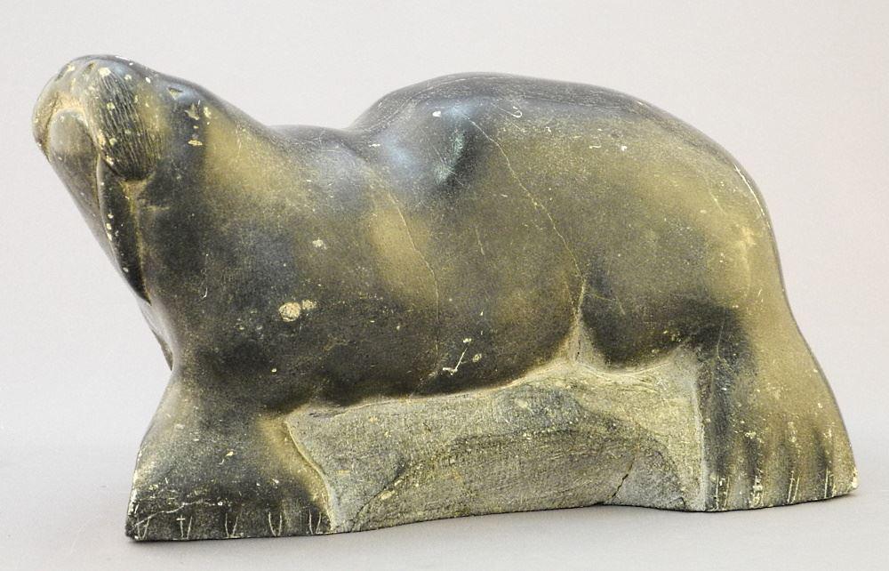 Inuit Stone Carving of a Walrus with 1 Tusk, 10" Length.: Inuit Stone Carving of a Walrus with 1 Tusk, 10" Length.