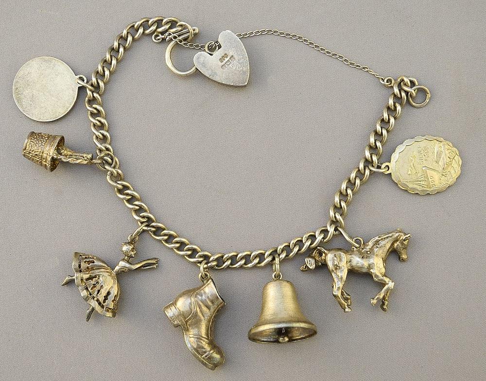 Hallmarked Silver Charm Bracelet with various Charms, 9.2 grams. (1 of 2)