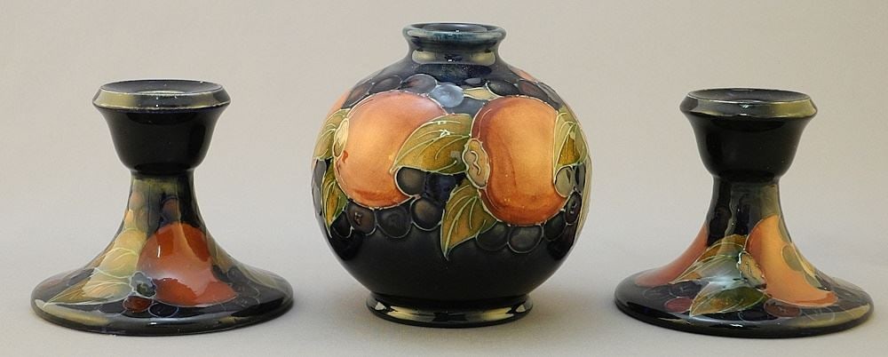 Pair of Moorcroft Pomegranate Candlesticks, 3 1/4"H and Globular Vase, 4 1/8"H. (1 of 3)