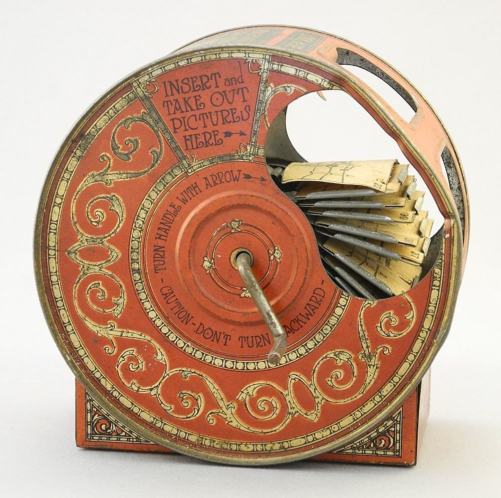 ZZWorld Syndicate Co. Newspaper Acting-Picture Machine, 4 7/8" x 2 1/2" x 4 7/8". (1 of 3)