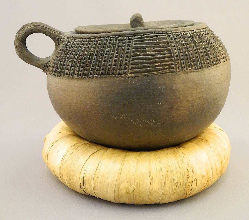 African Covered Vessel on Woven Fibre Stand.: African Covered Vessel on Woven Fibre Stand.