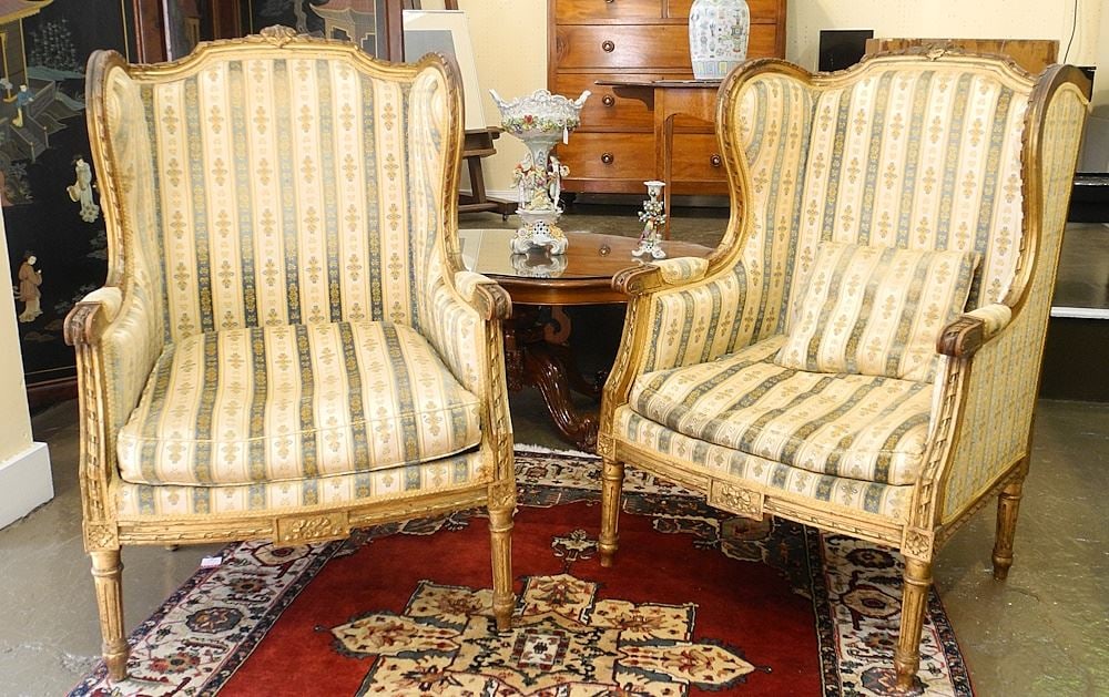 Pair of Louis XVI Giltwood Wingback Armchairs.: Pair of Louis XVI Giltwood Wingback Armchairs.
