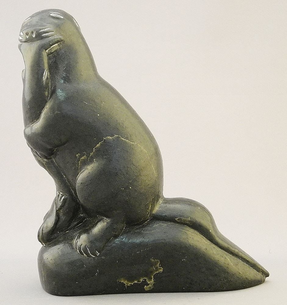 Inuit Sculpture signed Daniel Oweetaluktuk, 6" x 7" x 2 1/2", "Otter Eating Fish". (1 of 3)