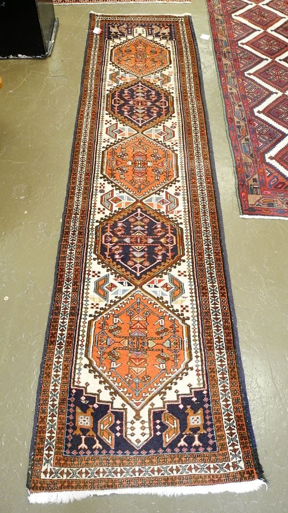 Hand Knotted Persian Runner Approximately 10'3" x 2'7". (1 of 3)