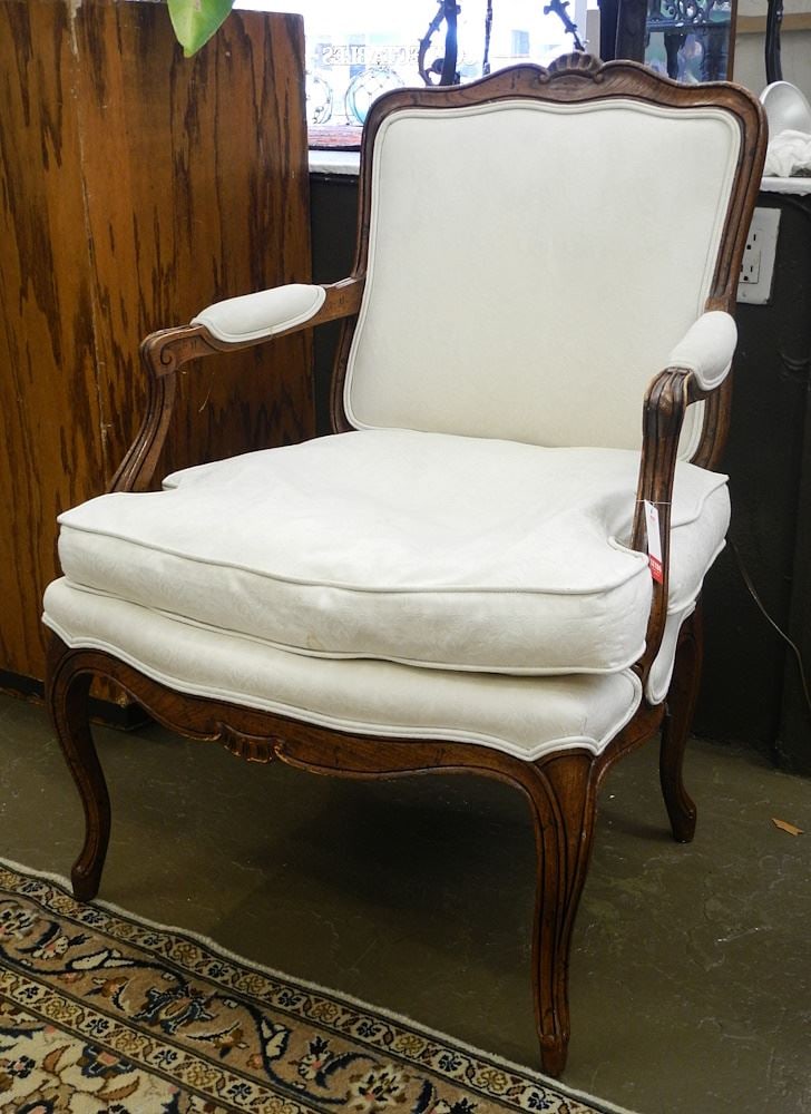 Louis XV Distressed Fruitwood Bergere Chair, 36 3/4"h (seat stained).: Louis XV Distressed Fruitwood Bergere Chair, 36 3/4"h (seat stained).