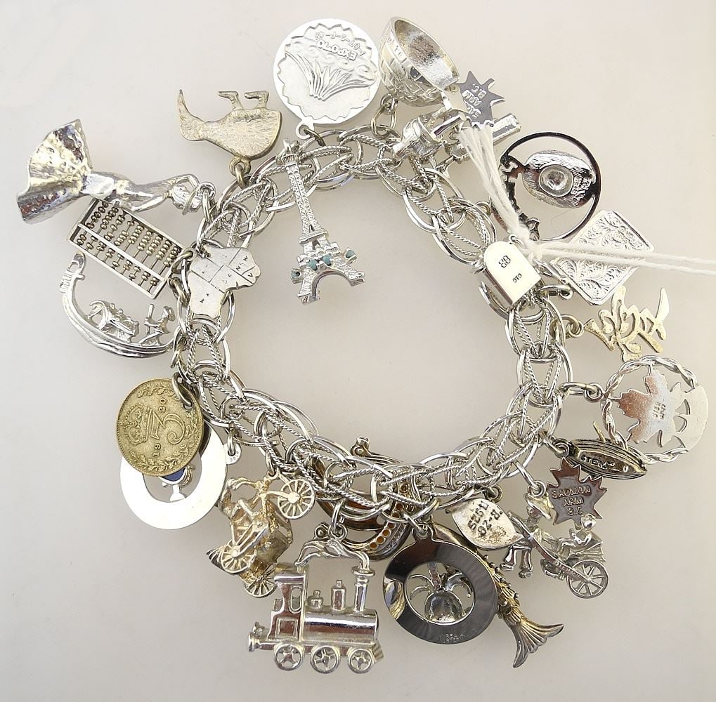 Birks STG Silver Charm Bracelet with Various Sterling and Silver Tone Charms.: Birks STG Silver Charm Bracelet with Various Sterling and Silver Tone Charms.