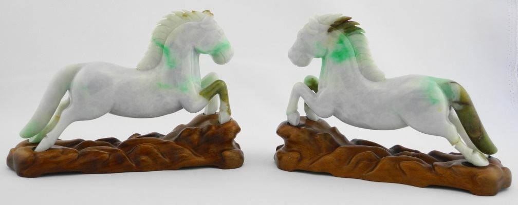 Pair of Carved Jadeite Figures of Galloping Horses (7") on Stands (one leg on each repaired).: Pair of Carved Jadeite Figures of Galloping Horses (7") on Stands (one leg on each repaired).