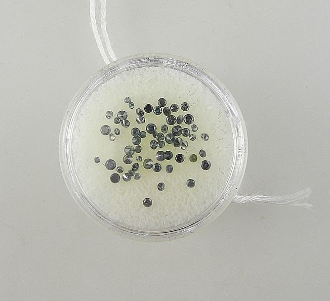 Collection of Fancy Blue Diamonds in Case.: Collection of Fancy Blue Diamonds in Case.