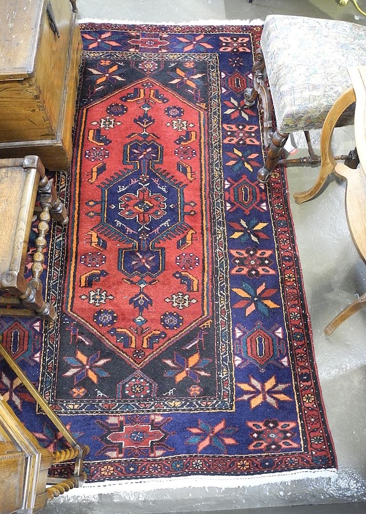 Hand Knotted Persian Carpet Approximately 7'5" x 4'5" (edge hole noted).: Hand Knotted Persian Carpet Approximately 7'5" x 4'5" (edge hole noted).