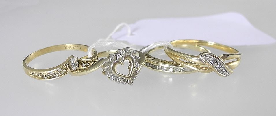 Four 10K (marked) Yellow Gold & Diamond Rings, Sizes 4 1/2/5/5 3/4/7 , TW 5.3g. (1 of 2)