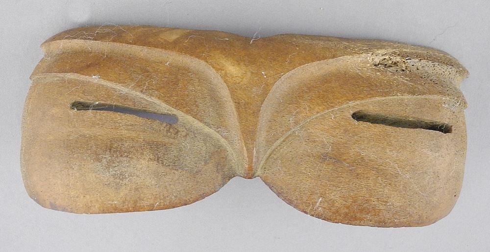 Pair of Fossilized Bone Inuit Snow Goggles, 3" x 7 1/4" x 1 3/4".: Pair of Fossilized Bone Inuit Snow Goggles, 3" x 7 1/4" x 1 3/4".