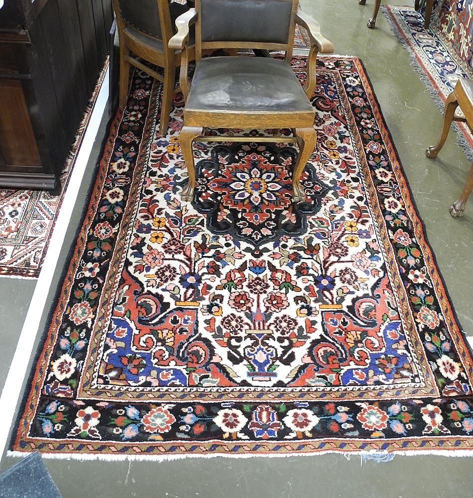 Iranian Hand Knotted Wool Carpet Approximately 4'11" x 8'3". (1 of 3)