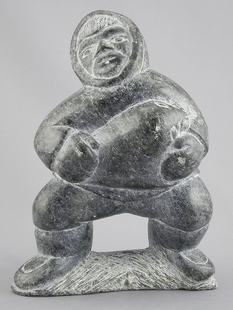 Inuit Stone Figure signed with Syllabics 135986, 7 7/8"h, "Figure with Seal". (1 of 3)