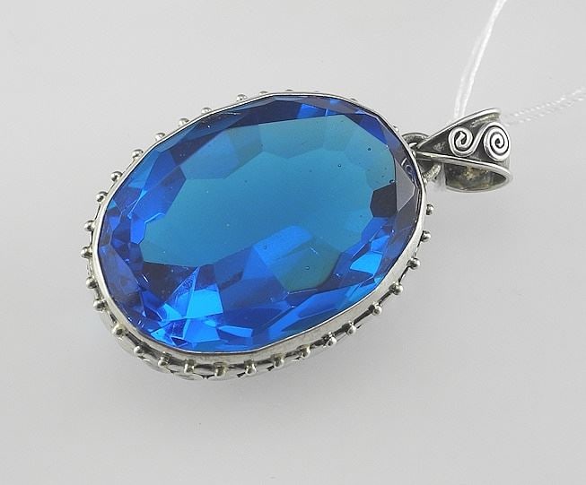 Faceted Blue Stone in Sterling Silver (marked) Setting, 1 1/2"h, 23.4g.: Faceted Blue Stone in Sterling Silver (marked) Setting, 1 1/2"h, 23.4g.