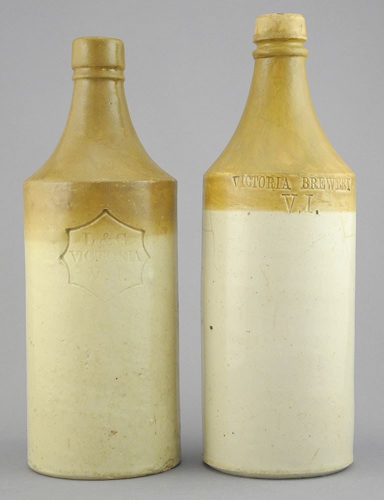 Two Victorian Brewery Bottles, 9 1/2 & 10 1/8"h (one restored & one cracked). (1 of 2)