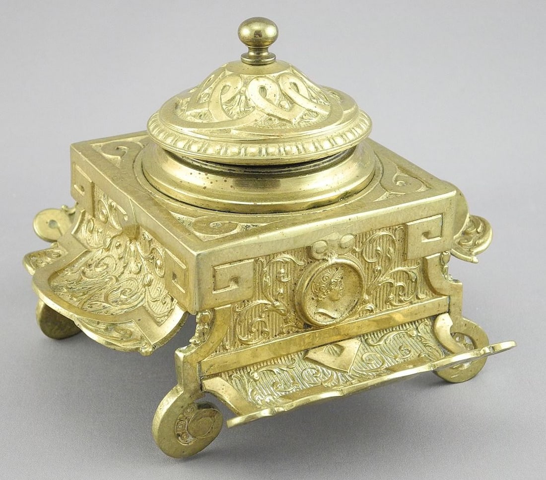 19th C. Brass Inkwell with Portrait Feature, 4 1/8"h (hinge noted).: 19th C. Brass Inkwell with Portrait Feature, 4 1/8"h (hinge noted).