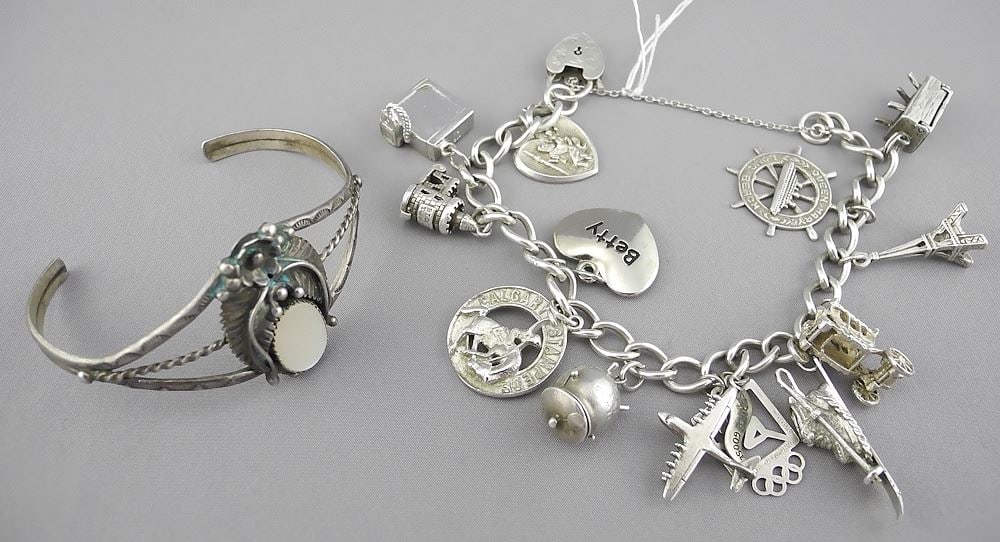 Silver (marked) Cuff Bracelet(15.2g) & Silver Charm Bracelet (some sterling charms), 57.8g. (1 of 2)