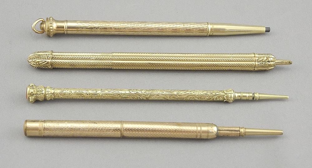 Collection of Four Gold Plated Propelling Pencils, 4 1/4". (1 of 3)