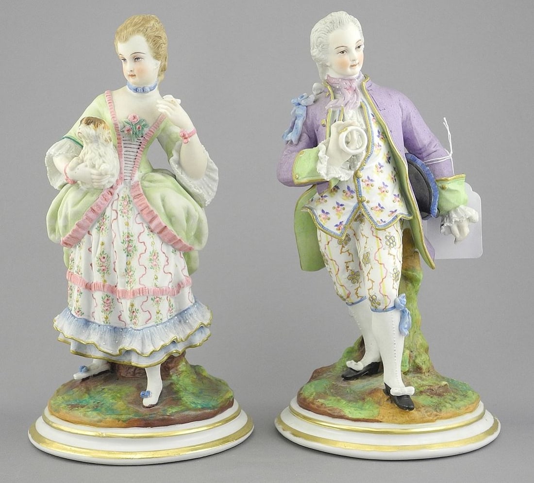 Pair of Bisque Porcelain Figures (one cracked).: Pair of Bisque Porcelain Figures (one cracked).