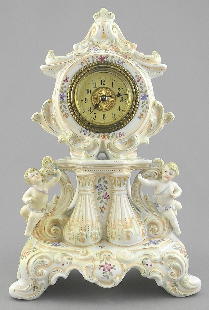 European Porcelain Mantle Clock, 10 1/2"h (Putti repaired). (1 of 3)