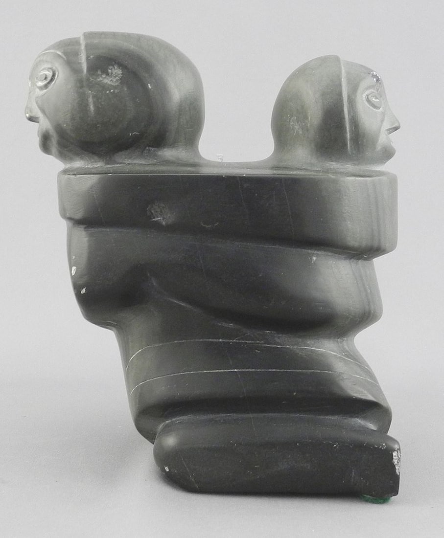 Inuit Stone Figure Marked 129470, 5 3/4"h, "Woman with Child in Amanti ". (1 of 4)