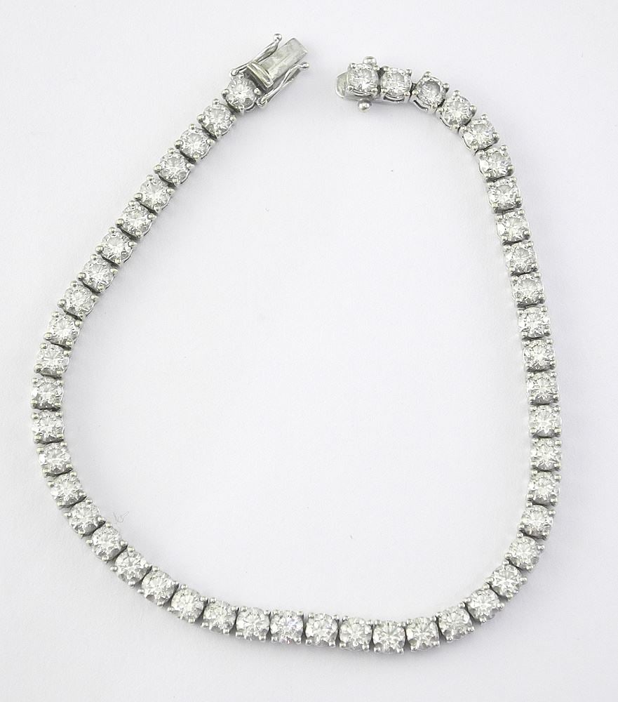 18K (marked) White Gold Tennis Bracelet, 7.5"L, 12.4g with Appraisal.: 18K (marked) White Gold Tennis Bracelet, 7.5"L, 12.4g with Appraisal.