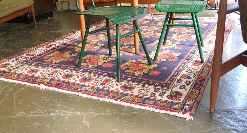 Persian Hand Knotted Rose Motif Carpet Approximately 8'5" x 5'7".: Persian Hand Knotted Rose Motif Carpet Approximately 8'5" x 5'7".