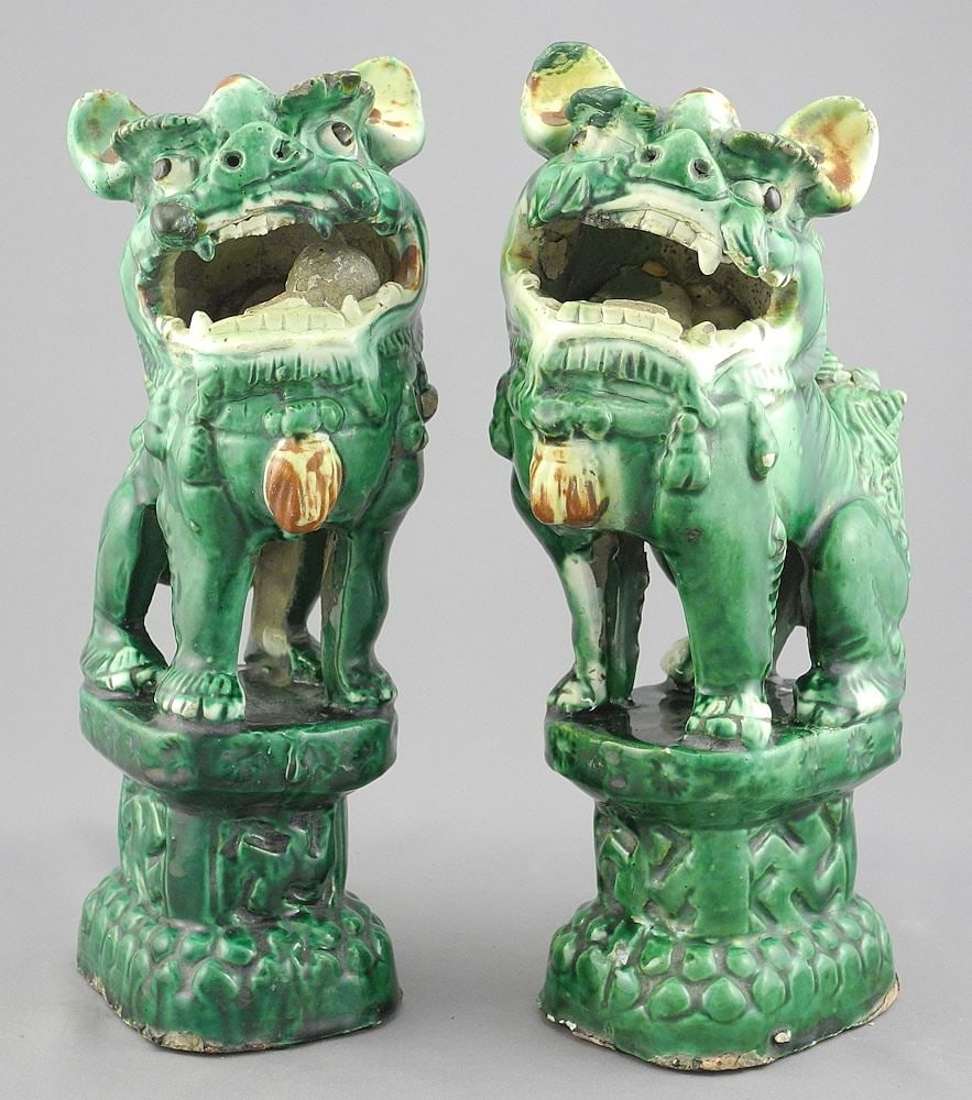 Pair of Sancai Glazed Buddhist Lion Dogs, 9 1/2"h (various restorations noted). (1 of 3)