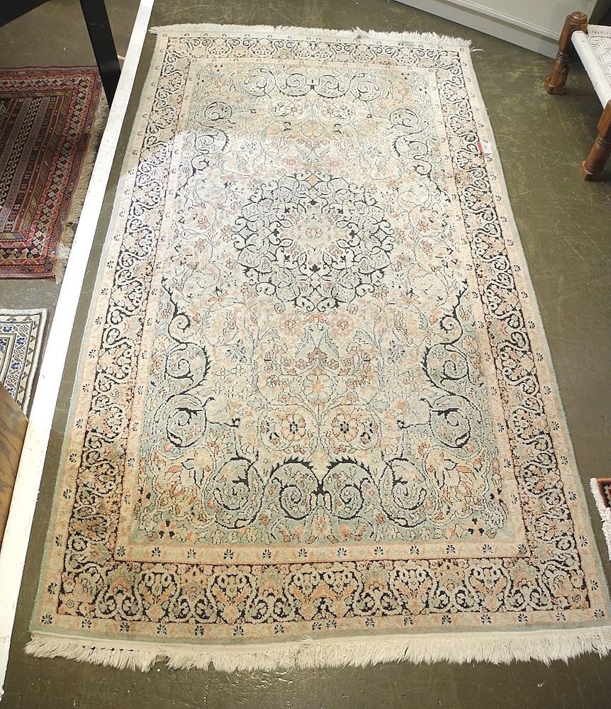Hand Knotted Silk Carpet Approximately 4'2" x 7'9". (1 of 2)