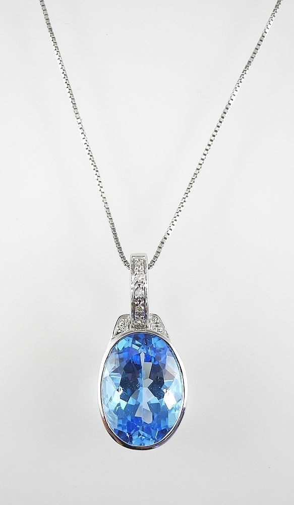 10K Gold Swiss Blue Topaz & Diamond Pendant (2.7g) & Silver Chain.: 10K Gold Swiss Blue Topaz & Diamond Pendant (2.7g) & Silver Chain.