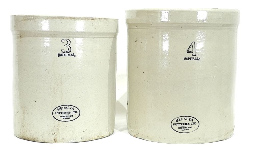 Three Medalta Crocks: 3/4/6 Gallon with Lid, 12 - 15 1/2"h (cracks noted).: Three Medalta Crocks: 3/4/6 Gallon with Lid, 12 - 15 1/2"h (cracks noted).