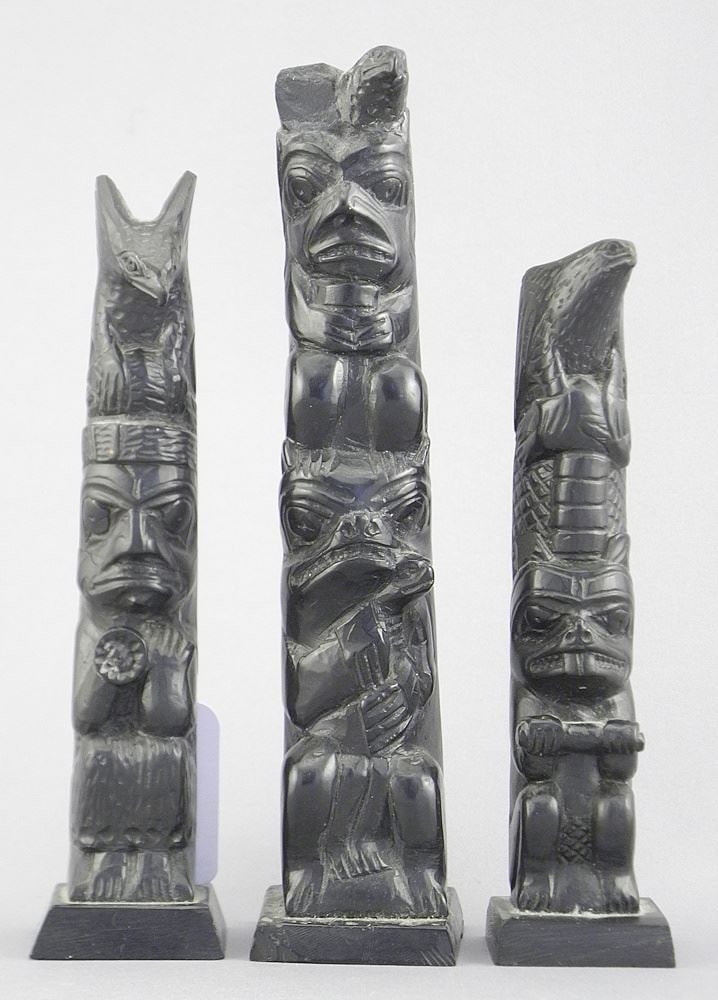Three Haida Argillite Model Totem Poles, 5 3/4 - 7"h (chipped & restored). (1 of 5)