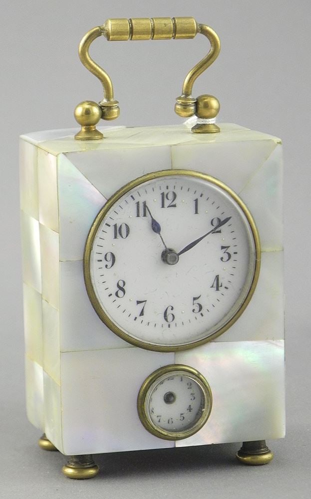 French Mother of Pearl Travel Clock, 2 7/8"h (alarm hand missing). (1 of 3)